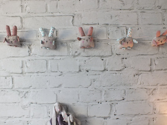 Cute linen Rabbit Garland to hang in a child’s bedroom or baby nursery, they have two alternating colours for their ears and arms, and threaded onto a strong thread. They are approximately 1.6 metres in length. Perfect for Baby Nursery Decor