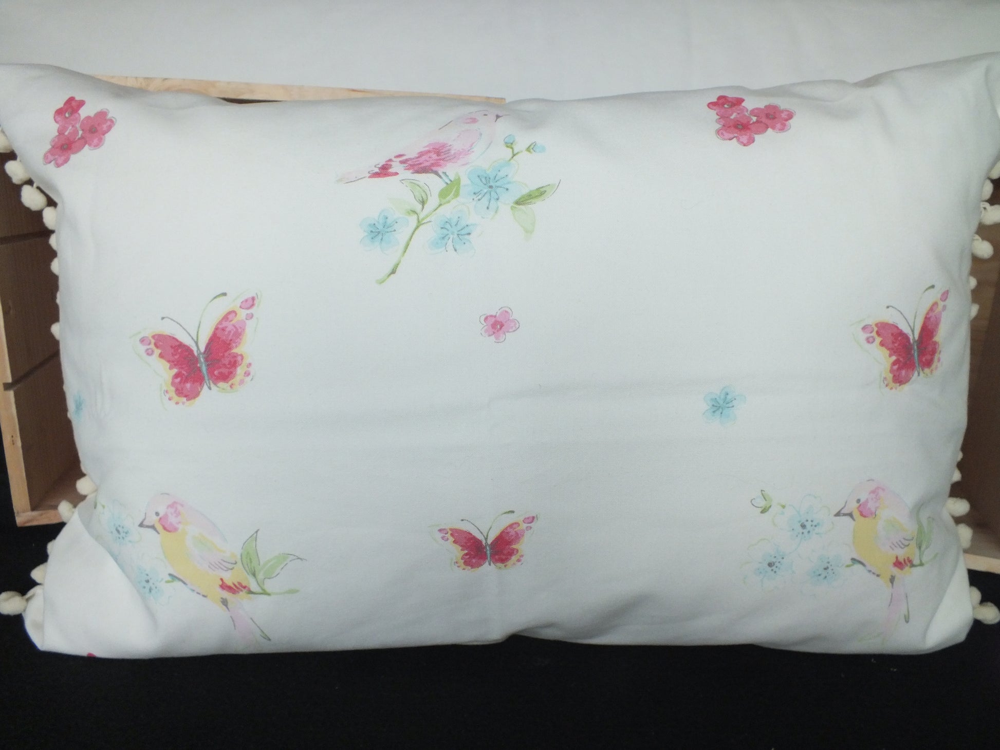 Laura Ashley Butterfly fabric Kids Bedroom Cushion, lovely rectangle cushions for children’s bedrooms. Also available in fire truck and construction and spring tree fabric.