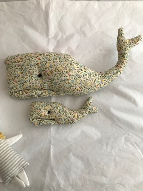 Set of two Mother & Baby Whale floral wall hanging perfect for a baby shower gift.  Measuring 26cm x 10cm and 13cm x 4.5cm and have a sewn loop on one side for easy hanging, just pop onto the bedroom wall!