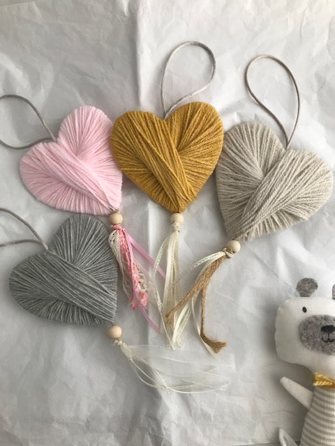 Wool heart hanging gift with lace and a bead. Perfect handmade unique gifts for the home in mustard, grey, cream and pink. Can be hung on a door or pinned to the wall.