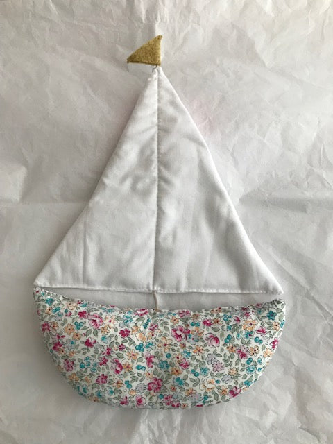 Large Sail Boat wall hanging is made with a floral Rose and Hubble boat and a fresh white cotton sail. It comes complete with a sewn hook ready to hang onto the wall in the baby nursery or children’s bedroom. Also available as a garland.