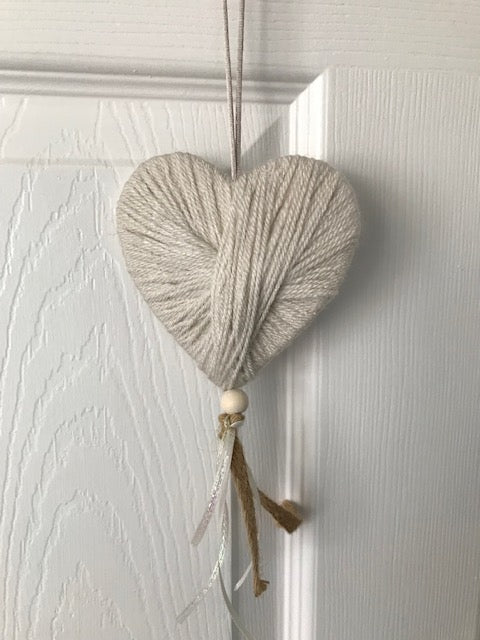 Wool heart hanging gift with lace and a bead. Perfect handmade unique gifts for the home in cream. Can be hung on a door or pinned to the wall.