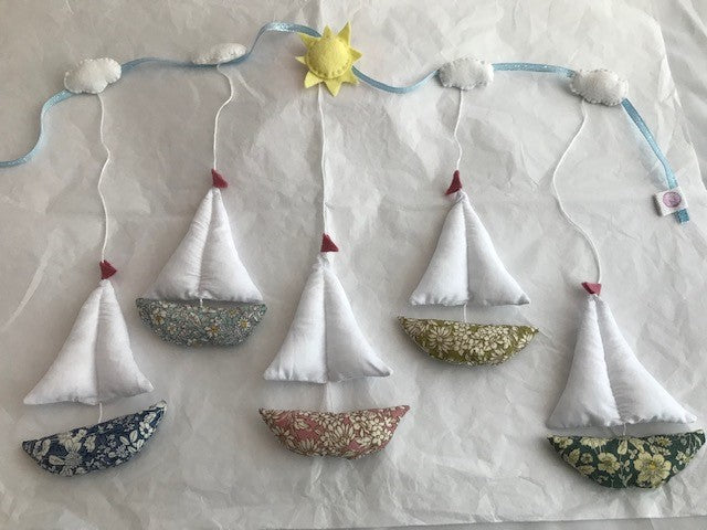 Sail Boats Garland wall hanging is made with a floral Rose and Hubble boat in different colours and a fresh white cotton sail, these can be hung onto the wall in the baby nursery or children’s bedroom. Also available as a single large wall hanging.