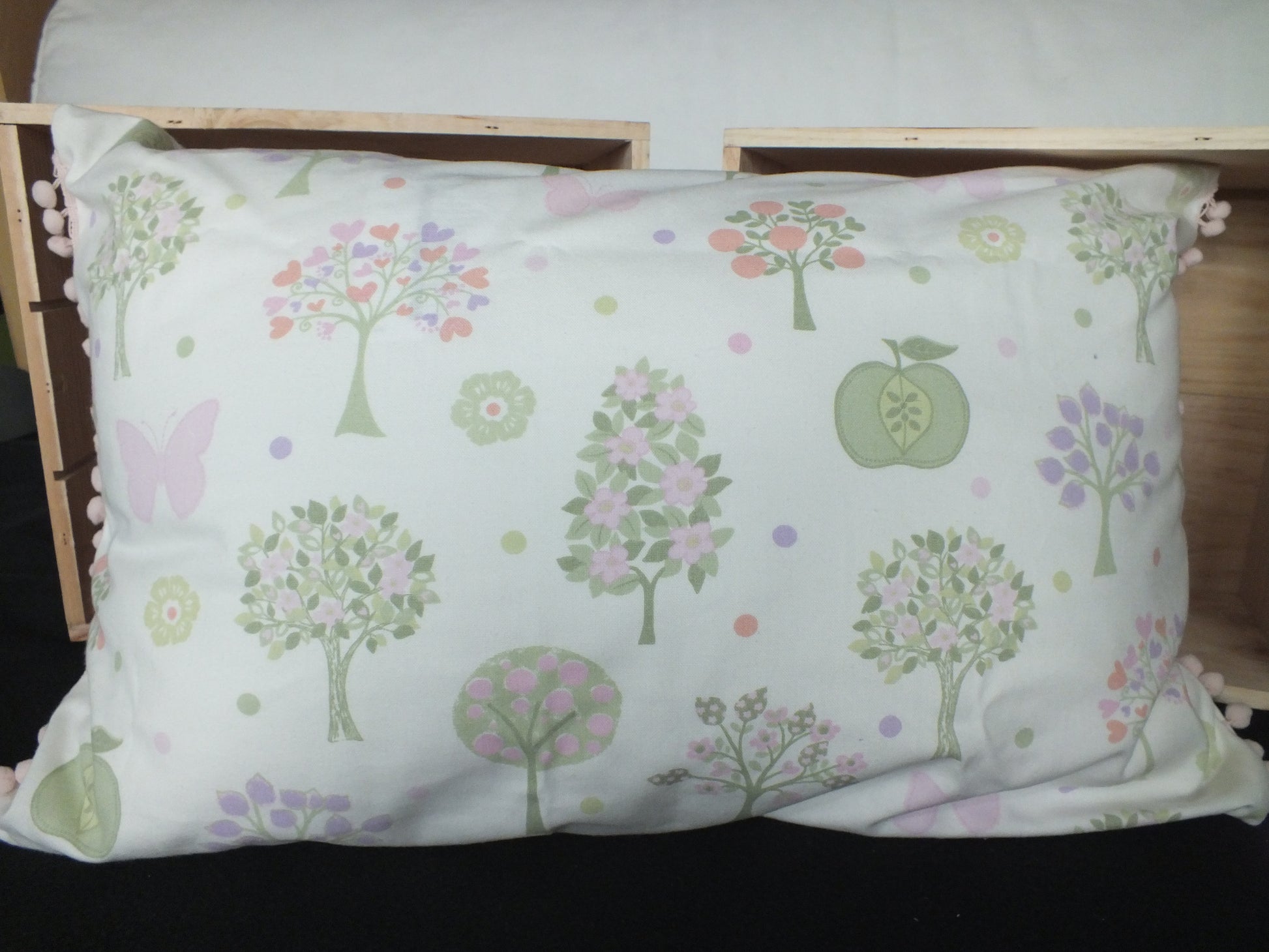 Laura Ashley Spring Tree fabric Kids Bedroom Cushion, lovely rectangle cushions for children’s bedrooms. Also available in fire truck and construction and butterfly fabric.