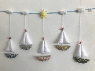 Sail Boats Garland. Has a floral boat in different colours, white cotton sail, can be hung onto the wall in the nursery or kids bedroom. Available as a single large wall hanging