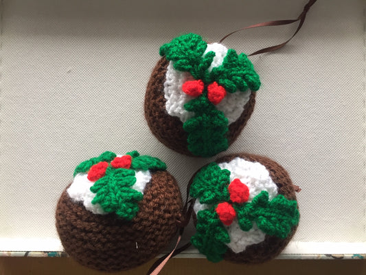 Three Knitted hanging Christmas Puddings Tree Decorations with knitted icing, two red berries and holly leaves, these make lovely unique Christmas Decor.