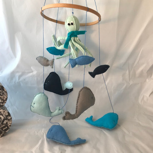 Handmade felt Octopus, Whale and Fish baby mobile in shades of blue and greys. These unique mobiles are perfect for the baby nursery and for baby shower gifts.