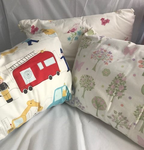 Laura Ashley fire truck and construction fabric Kids Bedroom Cushion, lovely rectangle cushions for children’s bedrooms. Also available in butterfly and spring tree fabric.