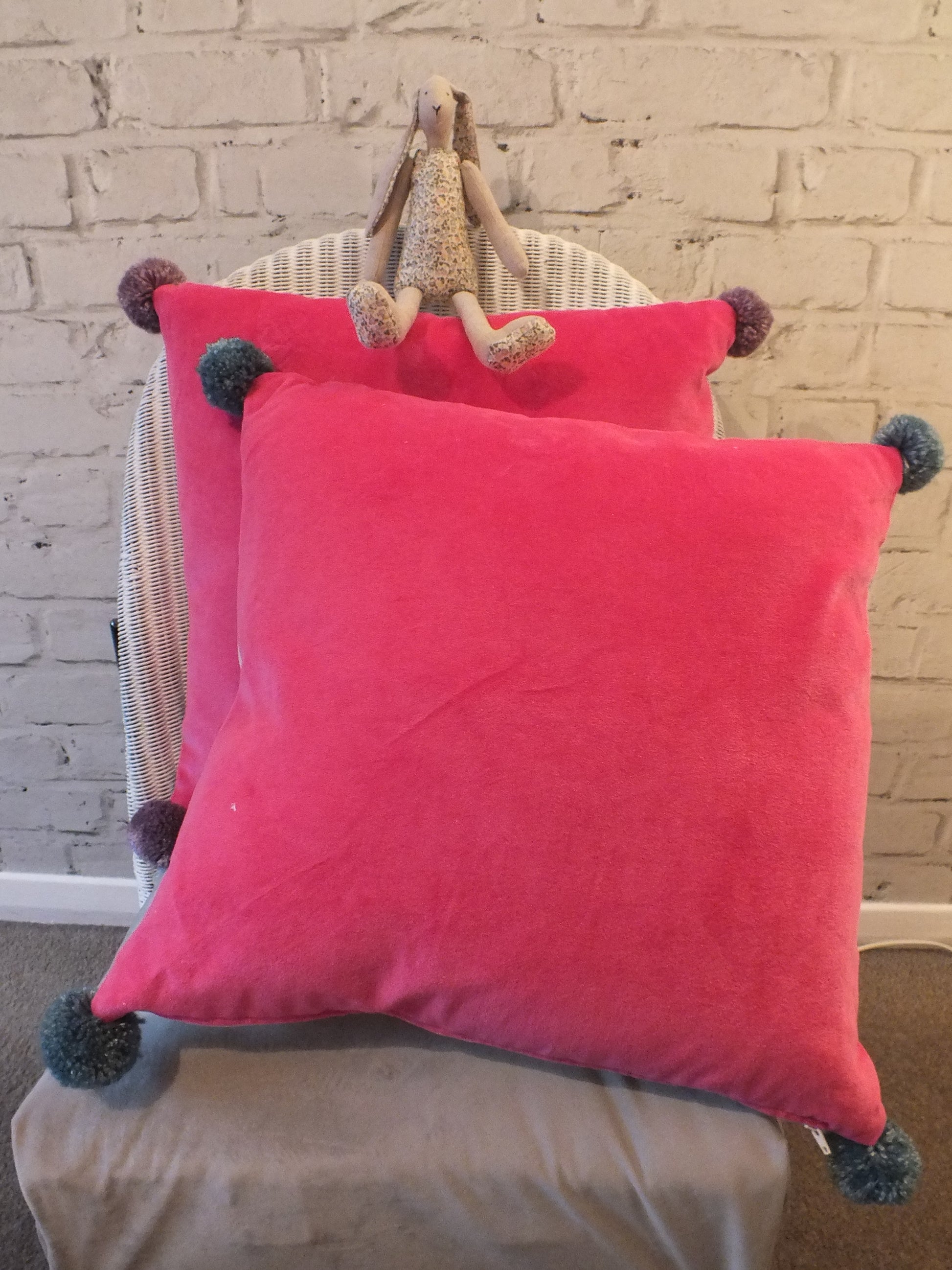 Handmade bright pink Faux Velvet with Pom Pom on each corner. These square cushions are perfect for children’s bedrooms.
